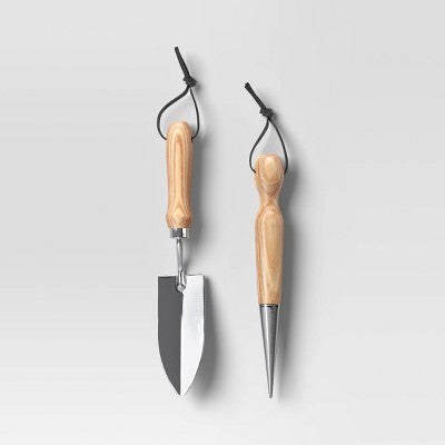 Dwa stalowe narzędzia do pielęgnacji roślin doniczkowych